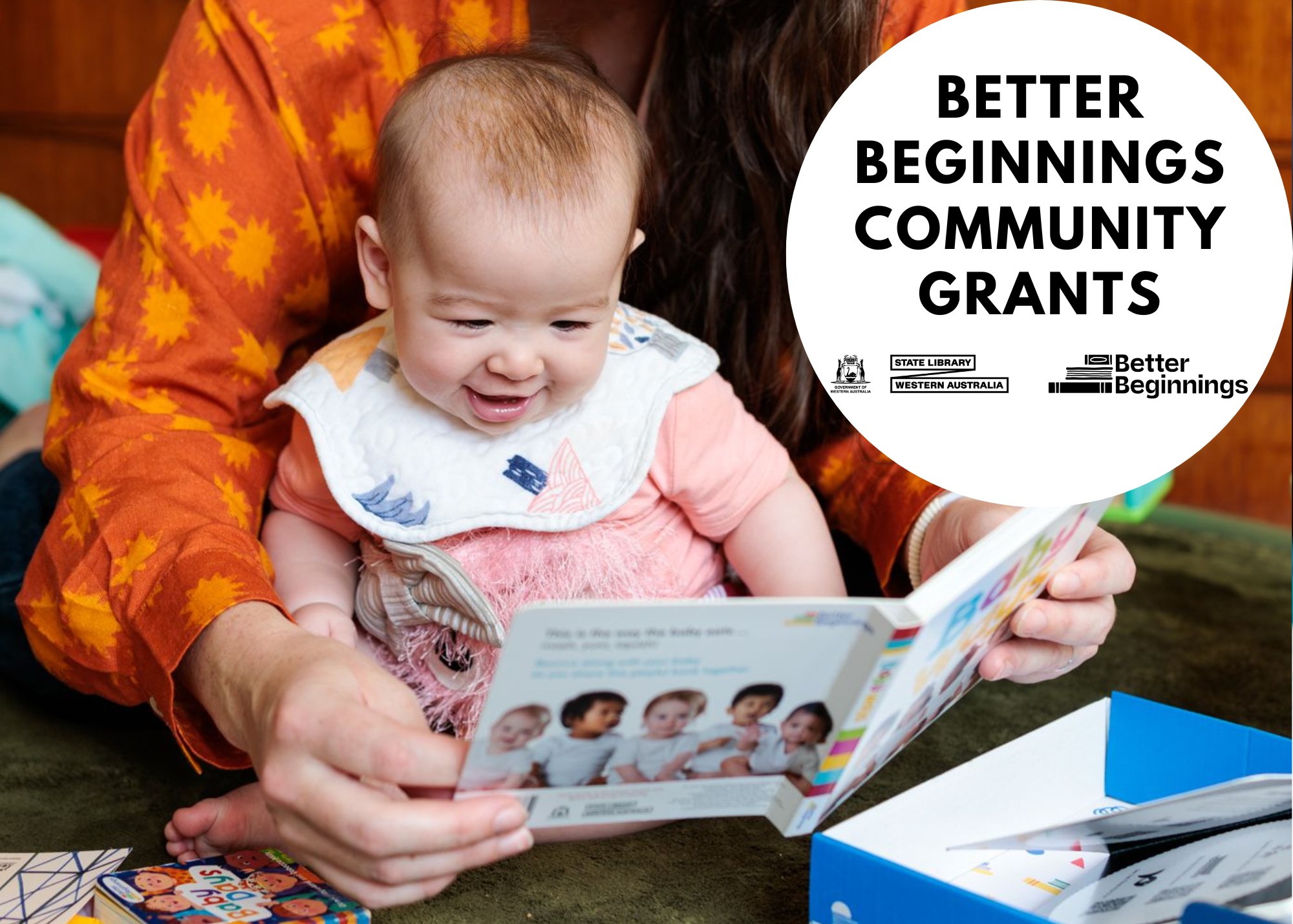 image of mother reading book to baby