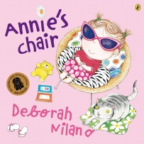 Annie's Chair book cover featuring a girl sitting on a chair with a cat nearby.