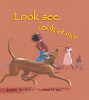 Look See, Look at Me! book cover featuring a boy running with a dog and his family in the background.