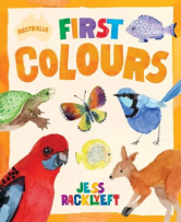 The book cover is a soft orange colour with the title “Australian First Colours” at the top. “Australia” appears inside a small outline of Australia, “First” is in mixed colours and “Colours” is in orange. The cover also shows brightly coloured Australian animals including a blue wren, a butterfly, a fish, a rosella, a turtle and a kangaroo.