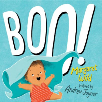 The book cover is blue with the title “Boo!” in bold white font taking up most of the page. In the bottom left corner, a baby in a red romper looks surprised as a blanket is lifted above them, as if in a peekaboo moment.