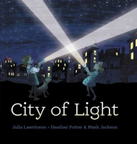 The cover shows a dark night scene with two children in old‑fashioned clothing shining torches into the sky, their beams crossing. They stand on a street with houses behind them, all lit from the windows. The title “City of Light” is written in white beneath the children.
