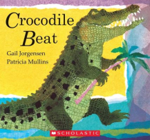 The cover is blue, green and yellow with a large crocodile standing on its hind legs holding a tree branch. The title “Crocodile Beat” is written in black font.